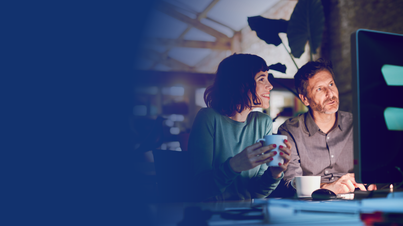 People looking at data on screen